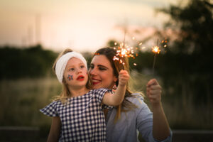 mother and daughter using sparklers